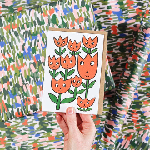 Klappkarte mit lächelnden Blumen